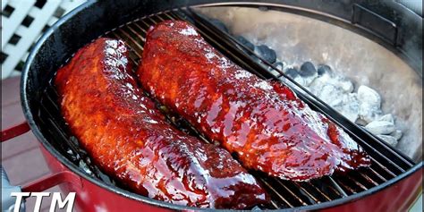 cooking baby back ribs on a weber charcoal grill